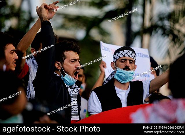 14 May 2021, Venezuela, Caracas: Some men from the Arab community shout, during a rally against the escalating violence in the Middle East