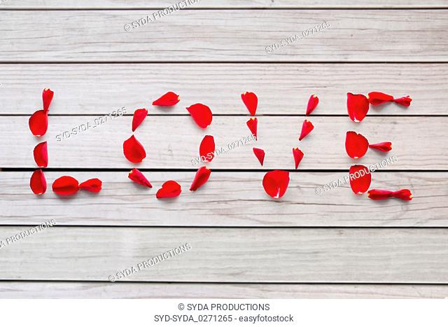 word love made of red rose petals