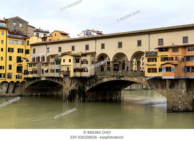 Ponte Vecchio and other similiar architecture buildings over the river