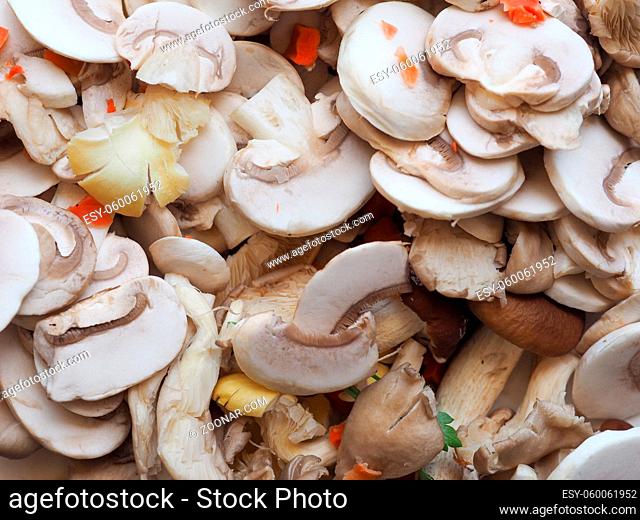 sliced agaricus bisporus aka champignons mushrooms with vegetables