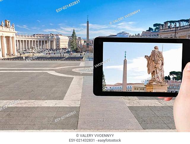 tourist taking photo of obelisk on St.Peter Square
