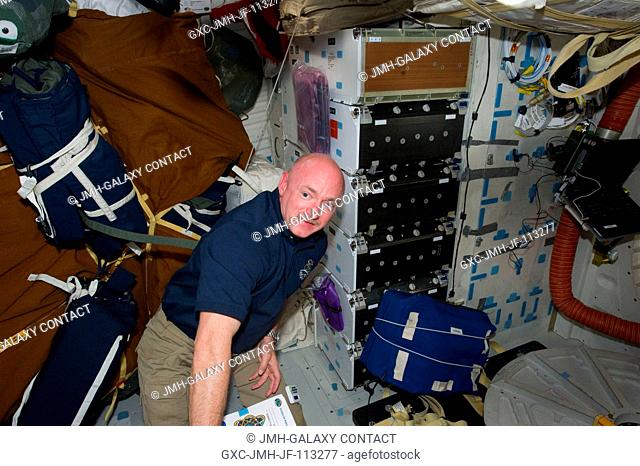 NASA astronaut Mark Kelly, STS-134 commander, is pictured on the middeck of space shuttle Endeavour while docked with the International Space Station