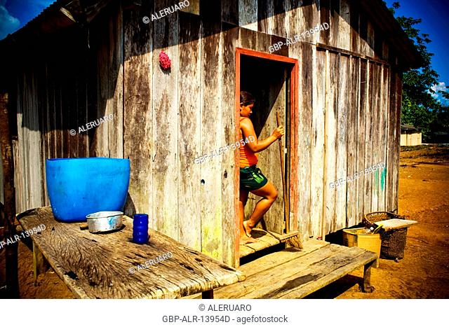 Woman Leaned in the Door, Castanha Community, Negro River, Novo Airão Amazonas, Brazil