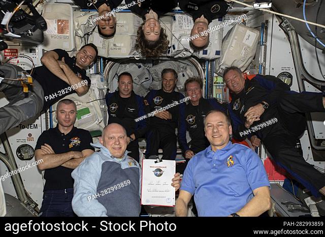 The 11-person crew photographed aboard the International Space Station (ISS) on April 9, 2022, comprises of (clockwise from bottom right) Expedition 67...