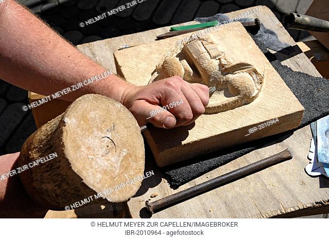Stonemason carving a figure in sandstone, detail, Nuremberg, Middle Franconia, Bavaria, Germany, Europe