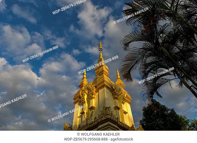 The evening light on the gilded stupa of Wat Prabat Tay (Wat Phra Bat Tai) in in the UNESCO world heritage town of Luang Prabang in Central Laos