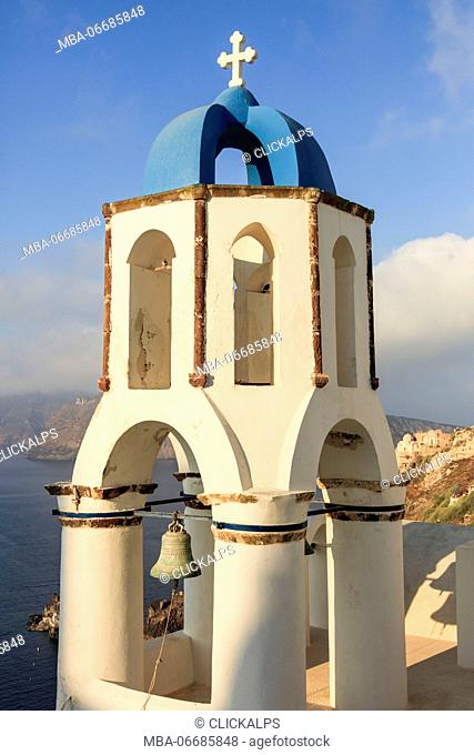 The blue dome of the church dominates the Aegean Sea Santorini Cyclades Greece Europe