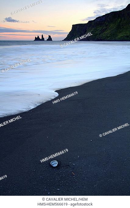 Iceland, Sudurland region, Vik, cliff and black sand beach of Vik, at the bottom the legendary rocks of Reynisdrangar