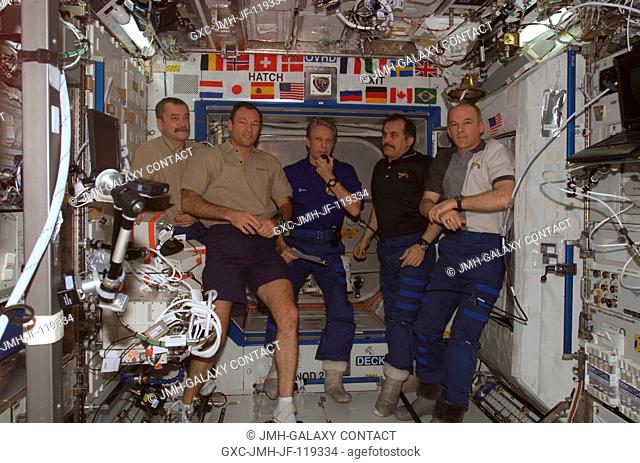 The crewmembers onboard the International Space Station participate in the ceremony of Changing-of-Command from Expedition 13 to Expedition 14 in the Destiny...