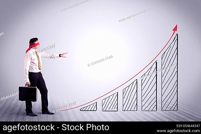 A young male office worker trying to find the right solution to develop a growing market concept with drawn exponential arrow