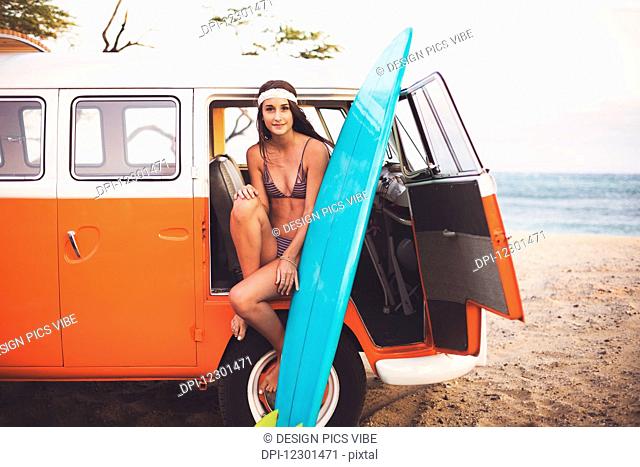 Beach Lifestyle, Beautiful Surfer Girl With Classic Vintage Surf Van On The Beach At Sunset