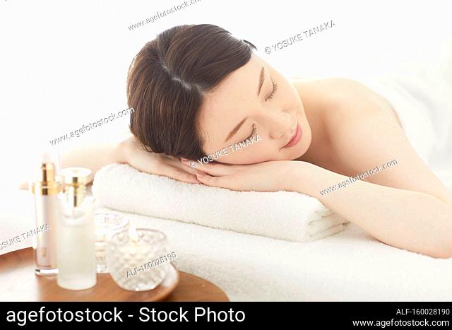 Japanese woman relaxing at a spa