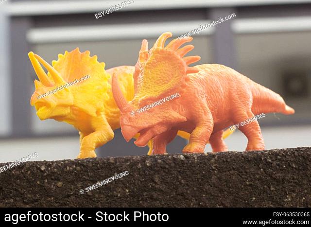 infrared image of the dinosaur toys on the asphalt street