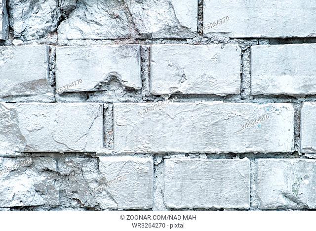brick stone wall painted in silver - graffiti background