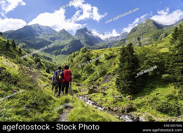 hikers on the trail, Ascending towards Hourgade Peak, L'Ourtiga, Luchon, Pyrenean mountain range, France