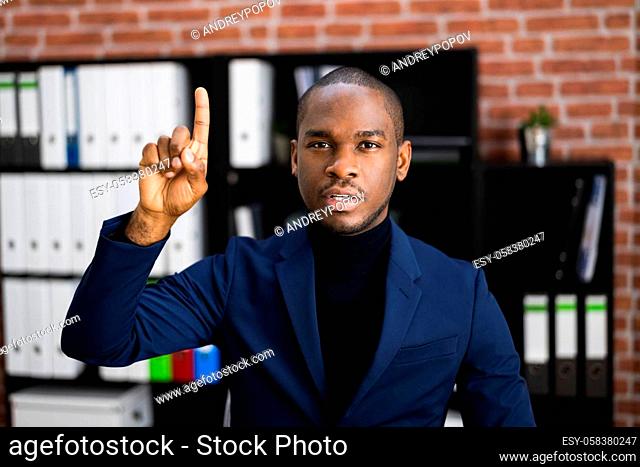 African American Man Raising Hand To Ask Question