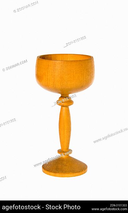 Carved wooden glass with rings on a white background