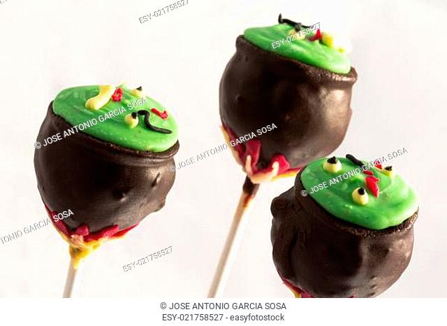 Halloween cake pops with holiday decor on white background