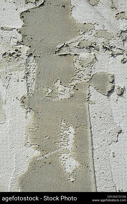 The texture of the wall, covered with gray foam polystyrene plates, which are smeared with a reinforcing mixture. Stage of wall insulation