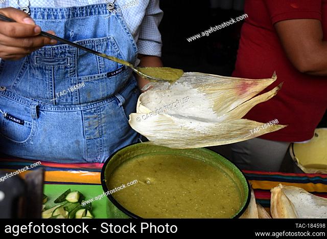 TEPOZTLAN, MEXICO - JANUARY 16: Isabel's daughter prepares 'Tamales' traditional Mexican food who are cooked in this season to celebrate the candlemas day