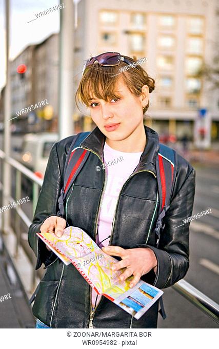 woman with city map in hands
