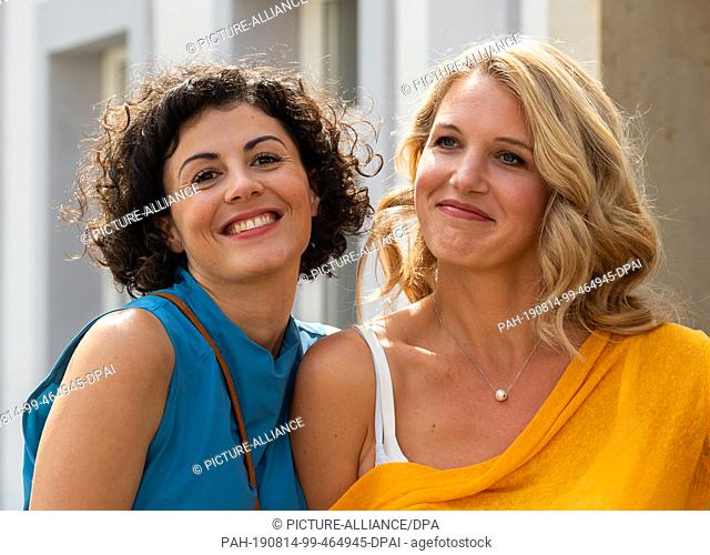 14 August 2019, Saxony, Stadt Wehlen: The actresses Liza Tzschirner (l) and Eva-Maria Grein von Friedl are on the edge of shooting the ARD television film ""Der...