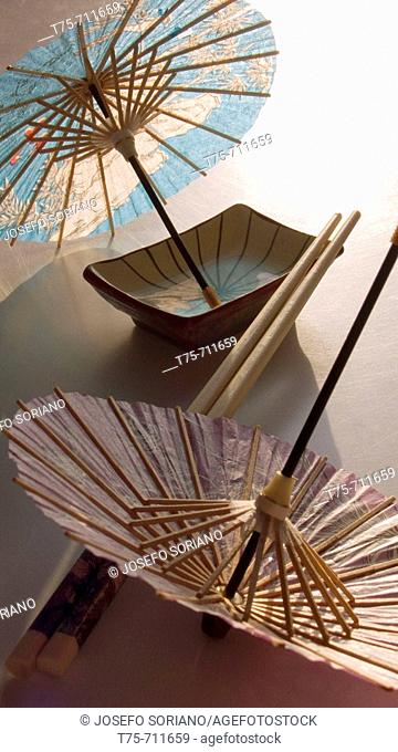 Chopsticks and oriental umbrellas