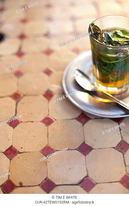 Glass of mint tea on restaurant table