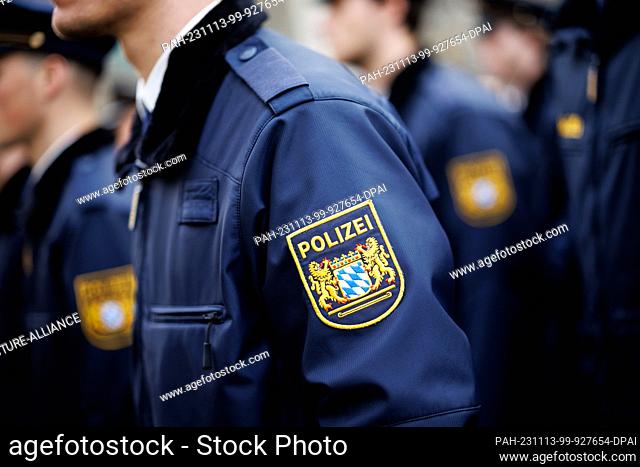 09 November 2023, Bavaria, Munich: The sleeve badge of the Bavarian state police, a coat of arms with the word ""Polizei"" (""Police"") with the large state...