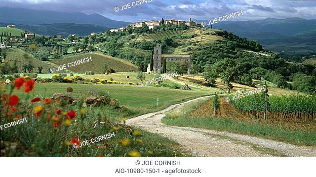 Abbey of Sant' Antimo, Tuscany. Hill town of Castelnuovo dell' Abate in background