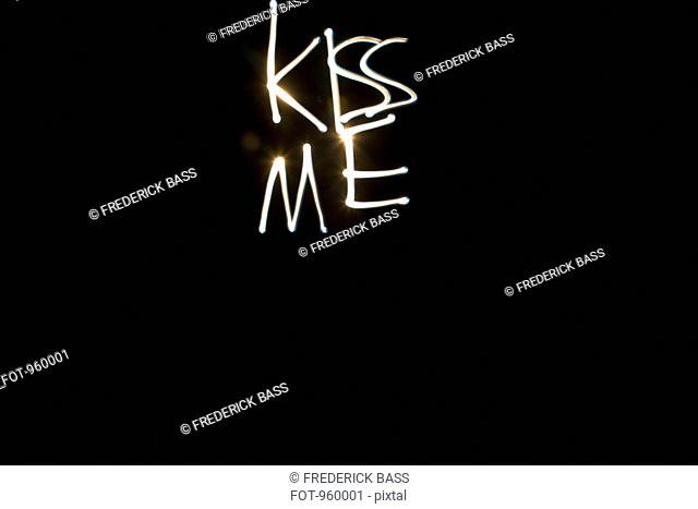 KISS ME written with light