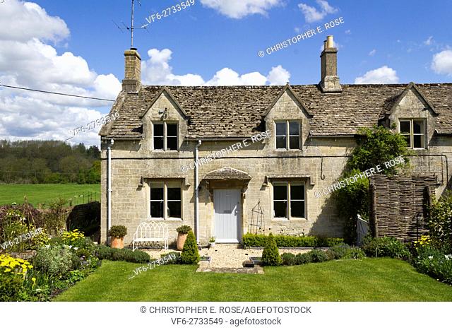 An idyllic rural Cotswold country cottage next to open countryside fields