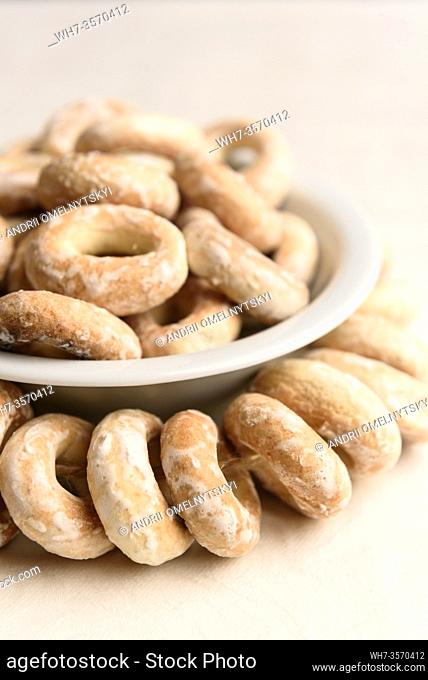 bundle of bagels on a white tablecloth in natural light
