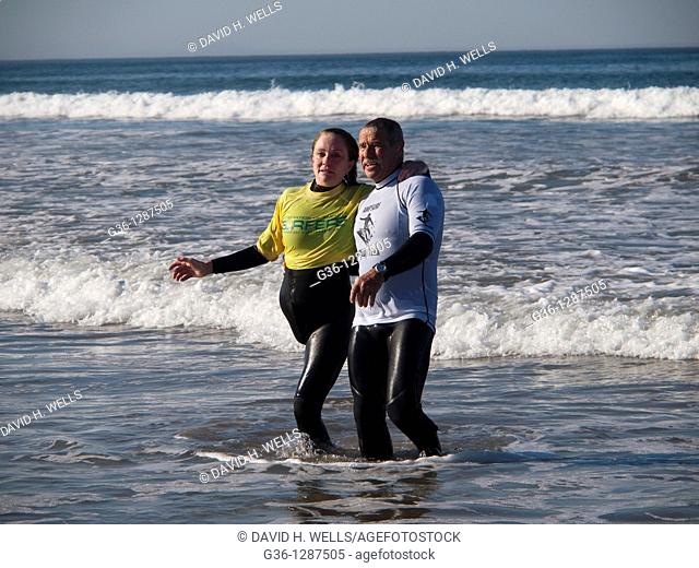 On the beach in Pismo Beach, California, during the Surf Clinic sponsored by AmpSurf, Julie Jo Caruthers, who lost one leg to Chondrosarcoma