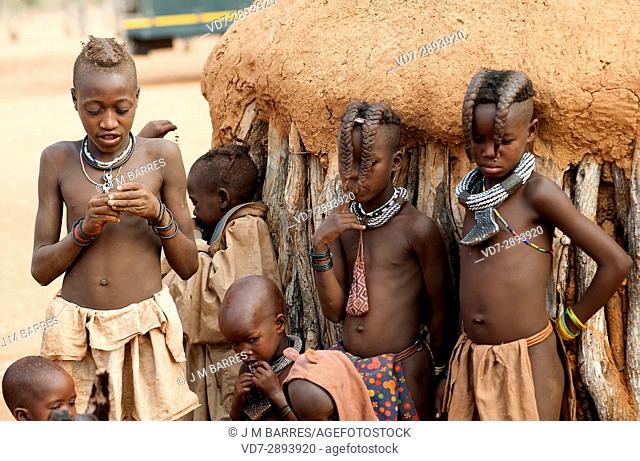 Himba boys and girls in his village. Epupa, Kunene Region, Kaokoland, Namibia