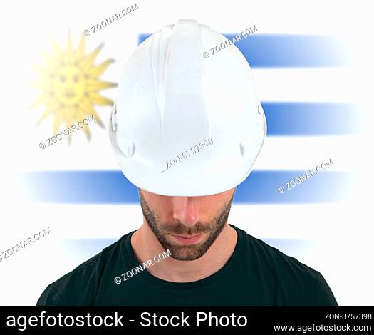 Isolated engineer with flag on background - Uruguay