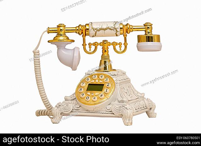 Retro old telephone with receiver and cord on a white background
