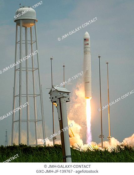 The Orbital Sciences Corporation Antares rocket launches from Pad-0A with the Cygnus spacecraft onboard, July 13, 2014, at NASA's Wallops Flight Facility in...