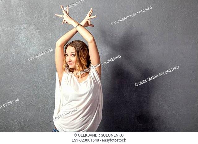 casual young woman posing with hands