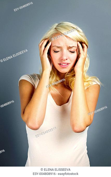 Unhappy woman holding her head