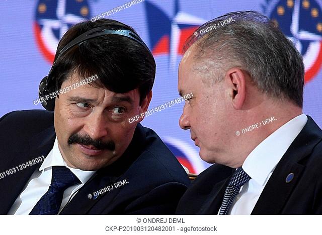 President of Hungary Janos Ader, left, chats with his Slovak counterpart Andrej Kiska as they attend the conference Our Security Is Not Taken For Granted