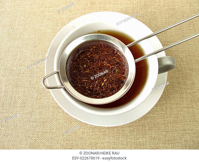 Rooibos tea in tea strainer