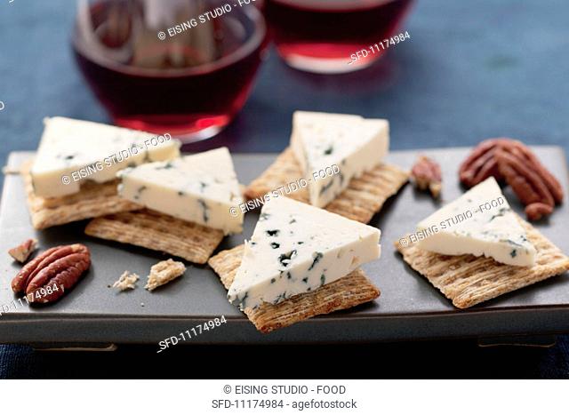 Blue cheese, crackers, pecan nuts and red wine