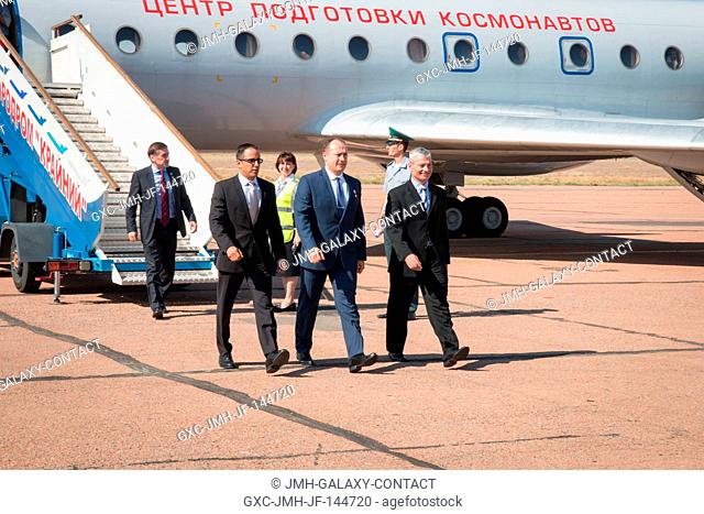 Expedition 53-54 crewmembers Joe Acaba of NASA (left), Alexander Misurkin of Roscosmos (center) and Mark Vande Hei of NASA (right) arrive at their launch site...