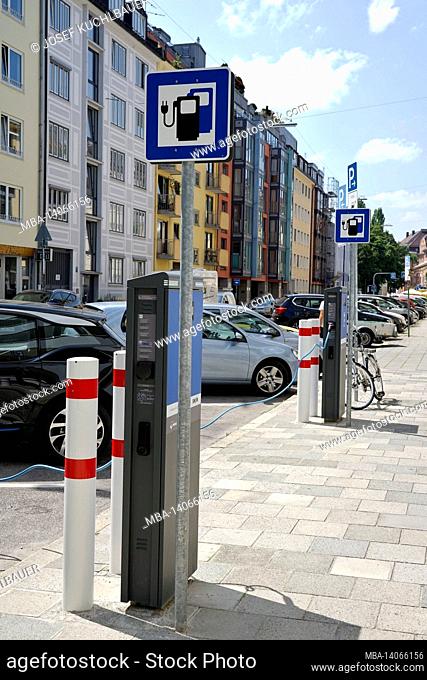 germany, bavaria, munich, munich-schwabing, residential area, street, electric cars at charging station