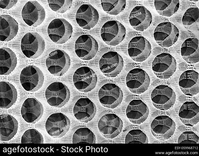 Background image with circles and ovals on the background of a grid structure. black and white image