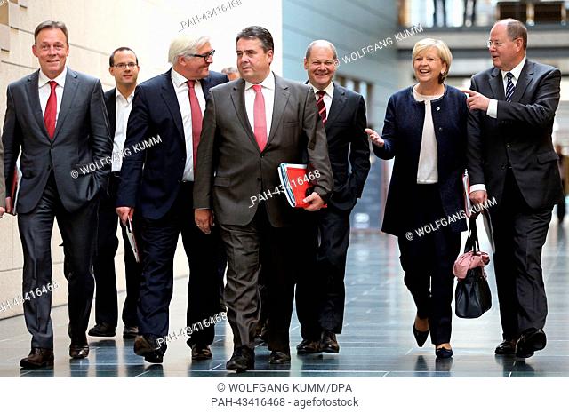 Chairman of the German Social Democratic Party (SPD) Sigmar Gabriel (C), parliamentary business manager Thomas Oppermann