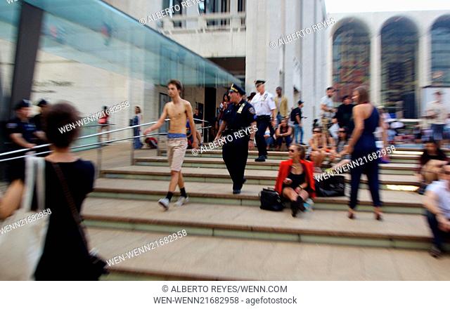 A shirtless man is kicked out of Lincoln Center and then arrested during Mercedes-Benz New York Fashion Week Featuring: Atmosphere Where: New York City