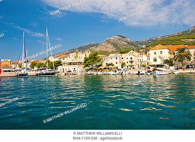 Bol Town and the crystal clear Adriatic Sea off Brac Island, Dalmatian Coast, Adriatic, Croatia, Europe