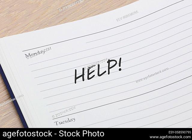 A Help diary reminder appointment open on desk